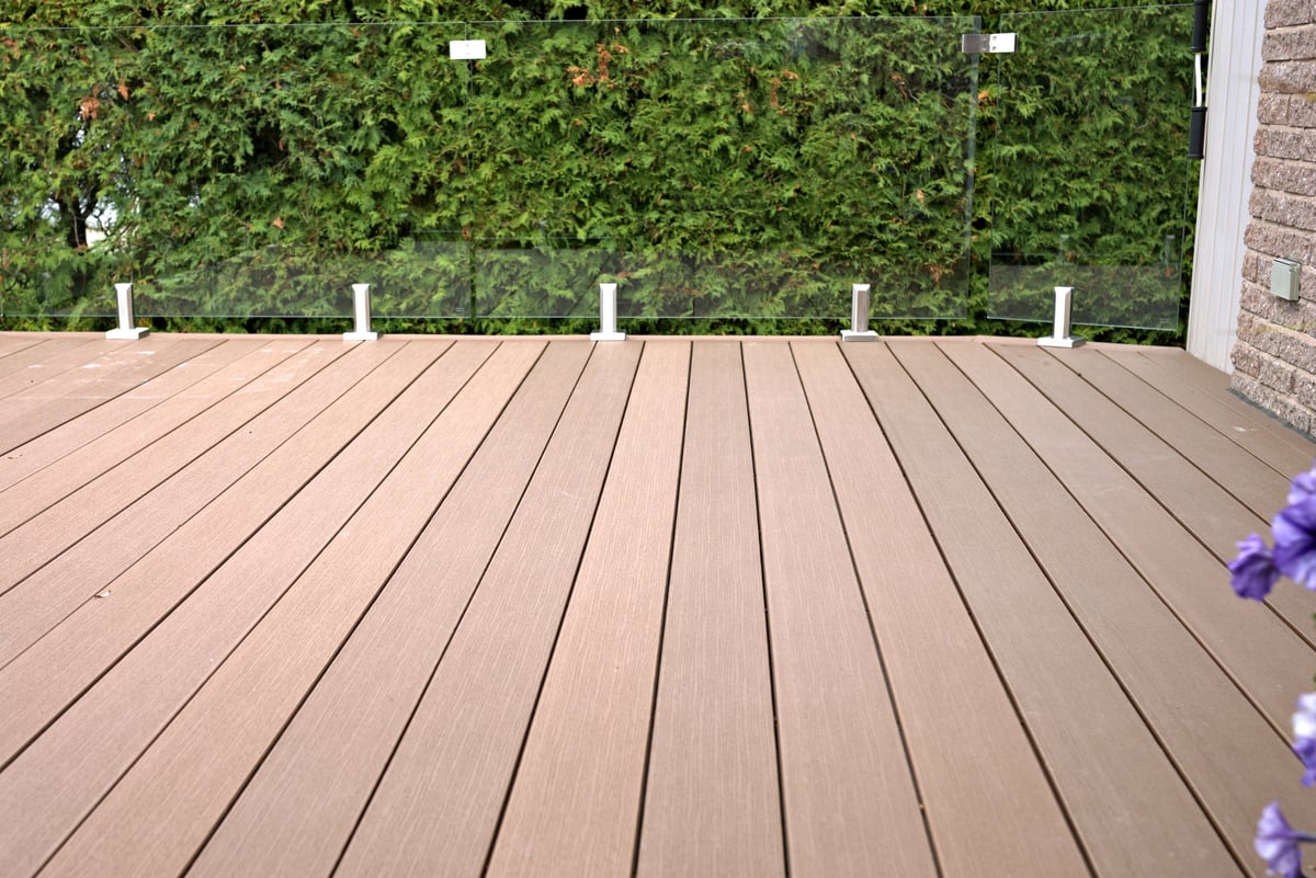 Trex composite deck with glass panel railing